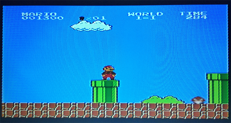 Игра Super Mario Bros. на экране телевизора